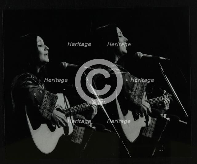 American folk musician Julie Felix performing at the Forum Theatre, Hatfield, Hertfordshire, 1979. Artist: Denis Williams