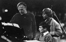 American musician Yehudi Menuhin (1916-1999) instructing his son Jeremy