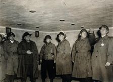 American soldiers examine a gas chamber, Dachau concentration camp, Bavaria, Germany, c1945
