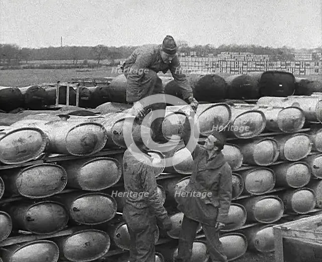 American Soldiers Working at a Fuel and Equipment Dump at an American Airfield in England, 1943-1944 Creator: British Pathe Ltd.
