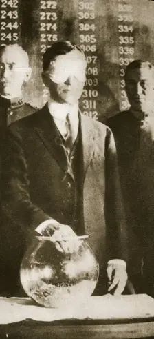 American Secretary of War Newton D Baker drawing the first number in the selective draft, 1917. Creator: Unknown