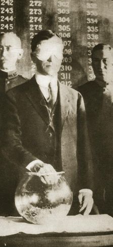 American Secretary of War Newton D Baker drawing the first number in the selective draft, 1917