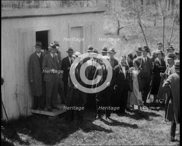 American Police Officers and Civilians in a Cemetery During a Kidnapping Investigation, 1930s. Creator: British Pathe Ltd.