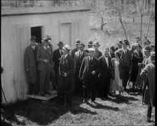 American Police Officers and Civilians in a Cemetery During a Kidnapping Investigation, 1930s. Creator: British Pathe Ltd