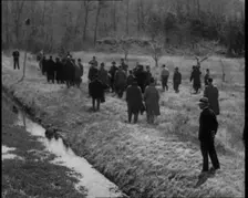 American Police Officers Searching the Area Outside American Aviator Charles Augustus..., 1930s. Creator: British Pathe Ltd