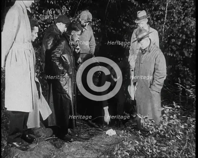 American Police Officers Searching the Area Outside American Aviator Charles Augustus..., 1930s. Creator: British Pathe Ltd.