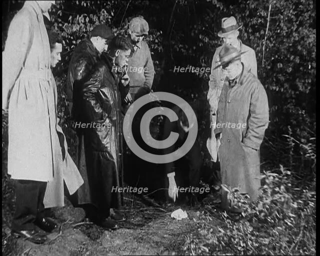 American Police Officers Searching the Area Outside American Aviator Charles Augustus..., 1930s. Creator: British Pathe Ltd.