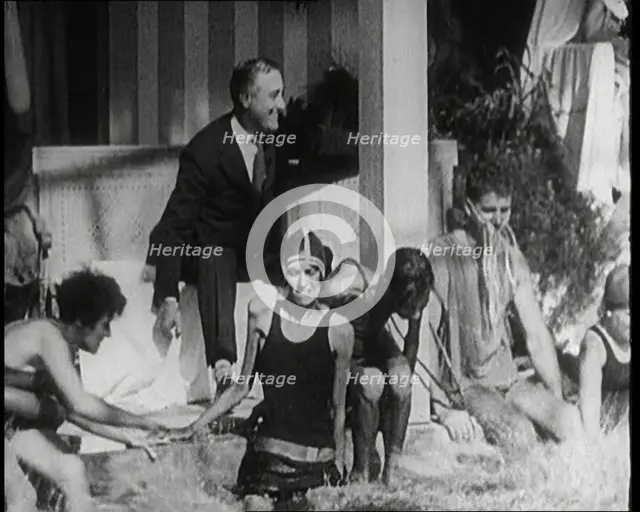 American Politician Franklin Delano Roosevelt Laughing as People Around Him Are Jumping..., 1921. Creator: British Pathe Ltd.