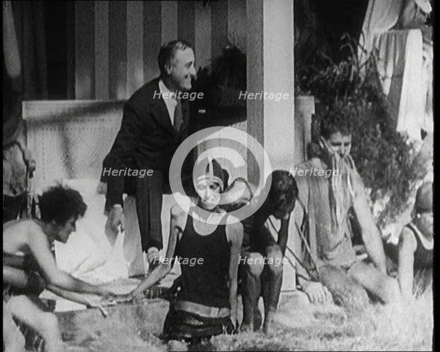 American Politician Franklin Delano Roosevelt Laughing as People Around Him Are Jumping..., 1921. Creator: British Pathe Ltd.