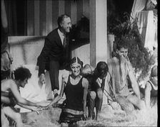 American Politician Franklin Delano Roosevelt Laughing as People Around Him Are Jumping..., 1921. Creator: British Pathe Ltd
