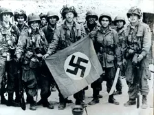 American parachute troops with a captured Nazi flag, Normandy, World War II, 6 June 1944. Creator: Unknown