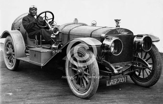 American world heavweight boxing champion Jack Johnson in a 1908 Austin 100hp Creator: Unknown.