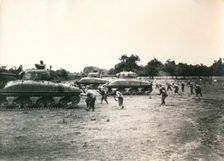 American tank and troops attack Périers, Normandy, July 1944. Creator: Unknown