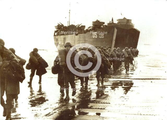 American troops disembark onto the sands of Normandy, 1944. Artist: Unknown