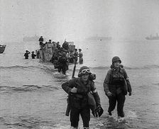 American Troops Walking Onto a North African Beach as Part of Operation Torch 1942. Creator: British Pathe Ltd