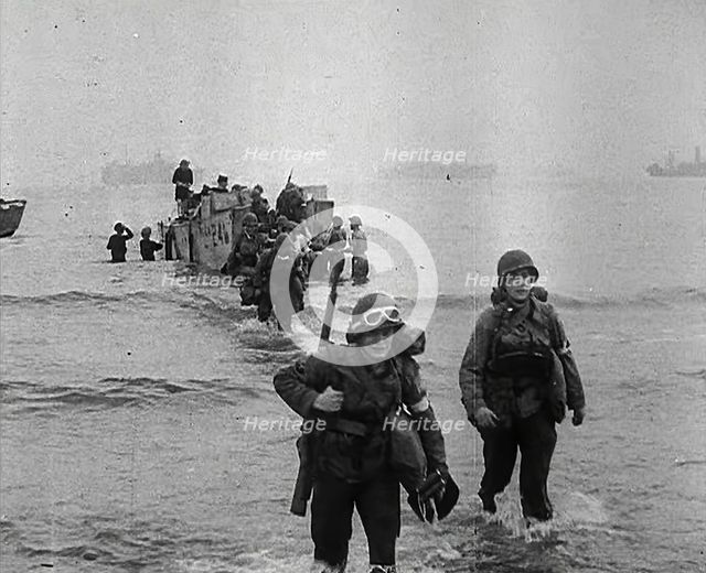 American Troops Walking Onto a North African Beach as Part of 'Operation Torch', 1942. Creator: British Pathe Ltd.