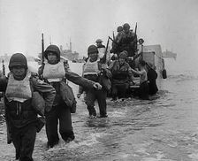 American Troops Walking Onto a North African Beach as Part of Operation Torch 1942. Creator: British Pathe Ltd