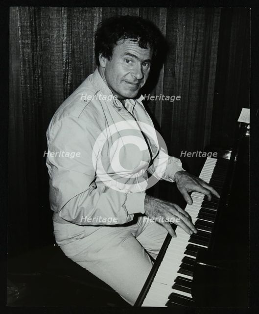American trombonist and teacher Phil Wilson playing the piano, London, 1985. Creator: Denis Williams.