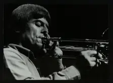 American trombonist Bill Watrous playing at the Forum Theatre, Hatfield, Hertfordshire, 1982. Creator: Denis Williams