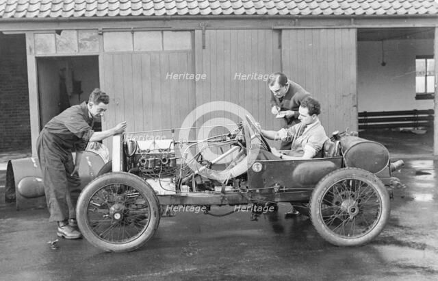 Amherst Villiers and a mechanic taking the revs of a Bugatti Cordon Rouge, c1920s. Artist: Unknown