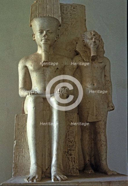 Amon seated beside Tutankhamun, statue made in calcite. Front View, 1350 b.C..