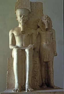 Amon seated beside Tutankhamun, statue made in calcite. Front View, 1350 b.C.