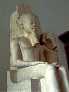 Amon seated next to Tutankhamun, statue made in calcite, 1350 BC