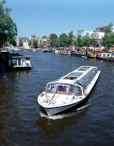 Amstel Canal and Bloumerbrug, Binnen, Amsterdam, Netherlands. Creator: Peter Thompson