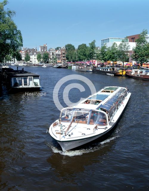 Amstel Canal and Bloumerbrug, Binnen, Amsterdam, Netherlands.  Creator: Peter Thompson.