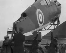 An American Aircraft Part Being Carried by a Crane to Be Sent by the USA to Britain, 1941. Creator: British Pathe Ltd