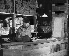 An American Store Keeper Logging Stocks of Supplies at a Storage Facility in an..., 1943-1944. Creator: British Pathe Ltd