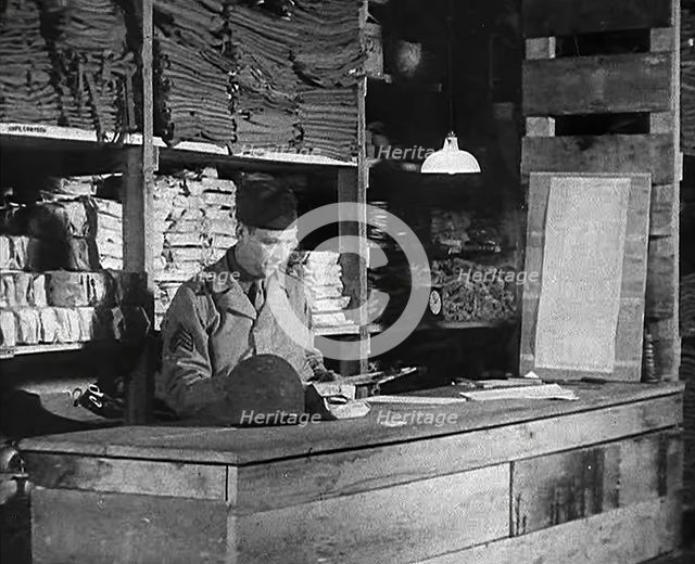 An American Store Keeper Logging Stocks of Supplies at a Storage Facility in an..., 1943-1944. Creator: British Pathe Ltd.