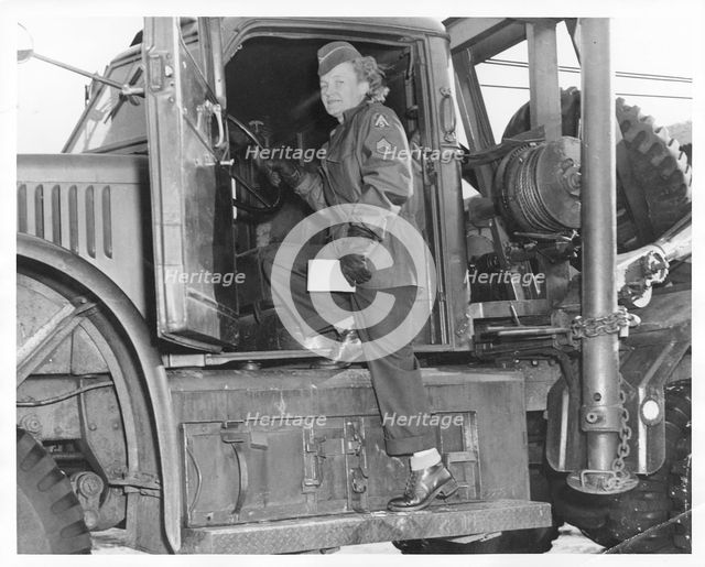 An American WAC sergeant climbing into an army truck, Fort Sheridan, Illinois, USA, 1940s. Artist: Unknown