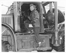 An American WAC sergeant climbing into an army truck, Fort Sheridan, Illinois, USA, 1940s