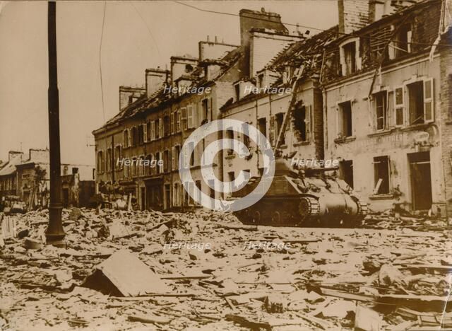 An American tank stands in a road in Cherbourg, Normandy, 1944. Artist: Unknown