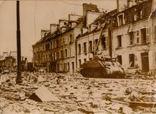 An American tank stands in a road in Cherbourg, Normandy, 1944. Creator: Unknown