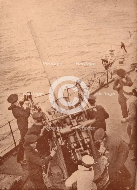 An anti-aircraft gun in action on a British battleship, c1917 (1919). Artist: Unknown.