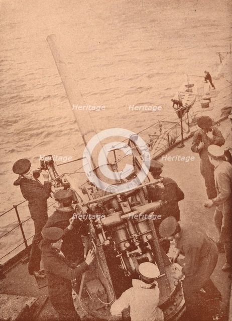 An anti-aircraft gun in action on a British battleship, c1917 (1919). Artist: Unknown.