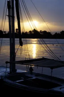 An anchored felucca on the River Nile at sunset
