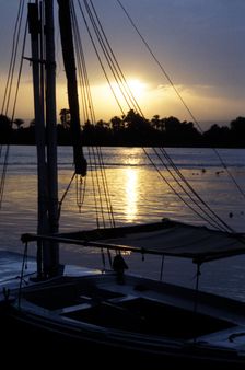 An anchored felucca on the River Nile at sunset