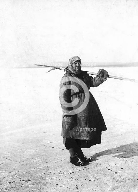 An Angarsk peasant woman goes to check the ouds, 1911. Creator: Unknown.