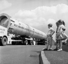 An absorption tower being transported by road, Dukenfield, Manchester, 1962. Creator: Michael Walters