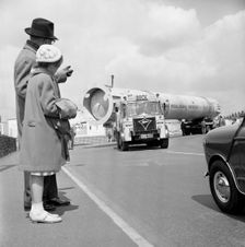 An absorption tower being transported by road, Dukenfield, Manchester, 1962. Creator: Michael Walters
