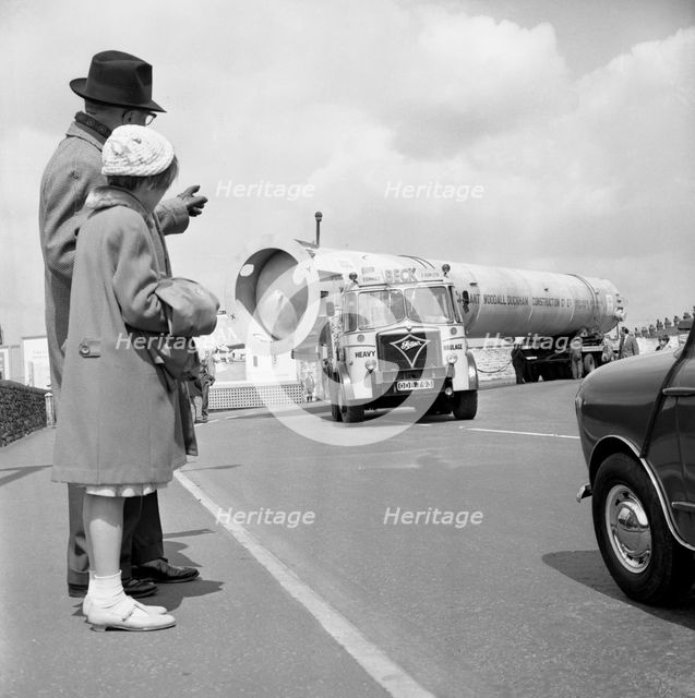 An absorption tower being transported by road, Dukenfield, Manchester, 1962. Creator: Michael Walters.