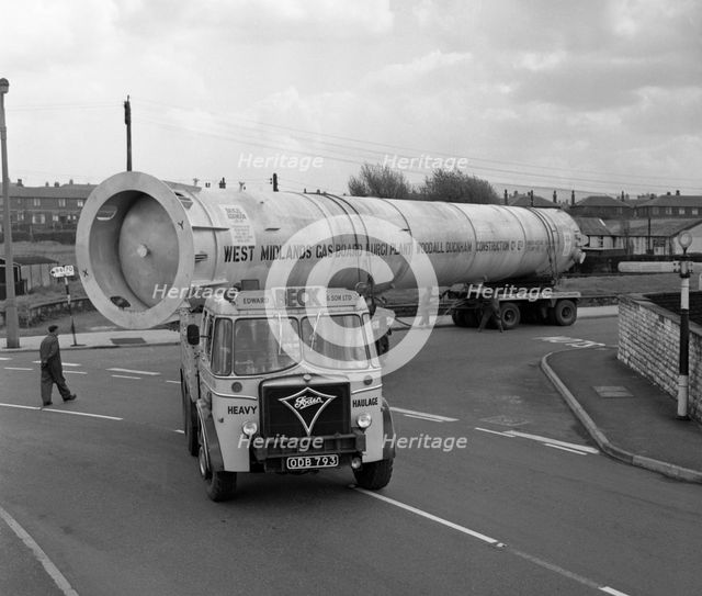 An absorption tower being transported by road, Dukenfield, Manchester, 1962. Creator: Michael Walters.