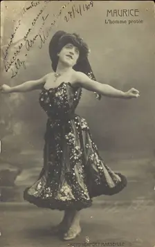 An actor in drag, known as "Maurice"; poses on stage mid-dance, 1908. Creator: Unknown
