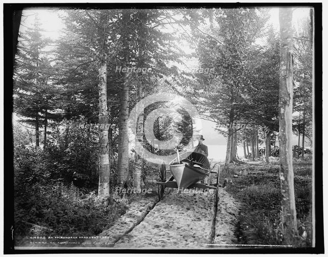 An Adirondack hand cart carry, c1902. Creator: William H. Jackson.