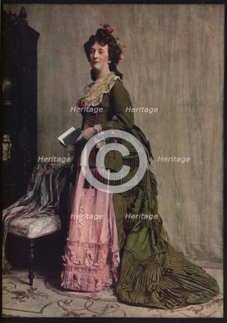 'An afternoon dress of green and pink silk. Very typical of the modes between 1868 and 1878', c1913. Artist: Unknown.