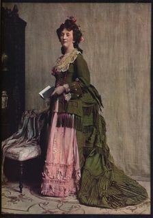An afternoon dress of green and pink silk. Very typical of the modes between 1868 and 1878 c1913