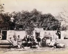 An affluent family forced to leave their home due to plague in their neighbourhood sitting...1896/7. Creator: Unknown